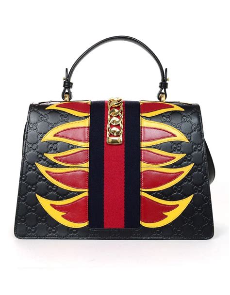 guccis flame bag|Gucci logo handbags.